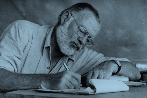 Ernest Hemingway writing a short story