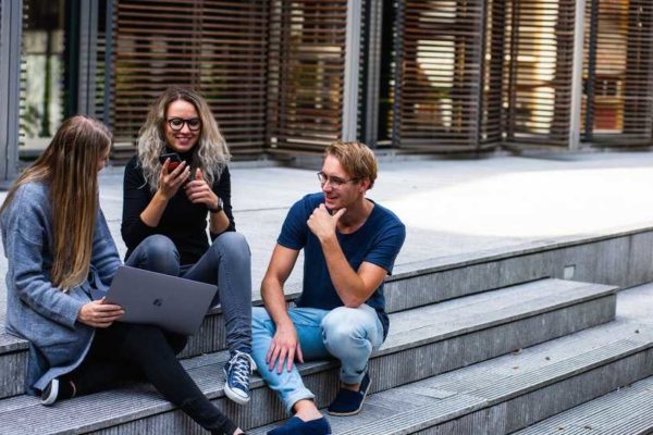 College students studying on library stairs