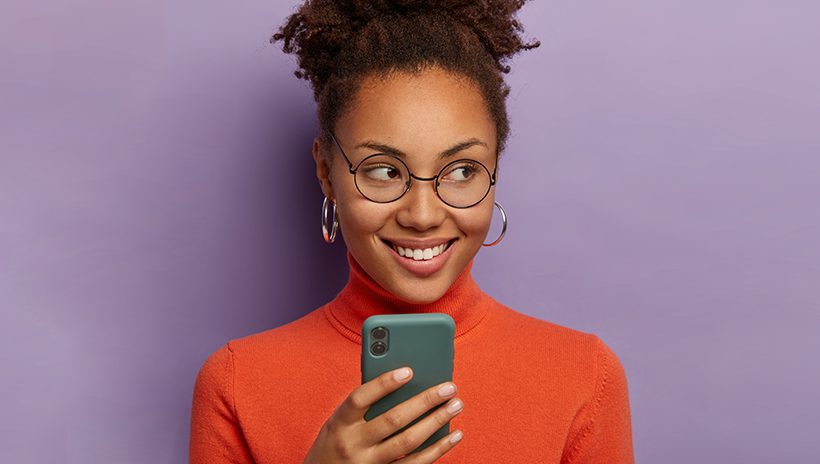 Student grins, gives sly look after identifying and debunking a conspiracy theory found via her phone