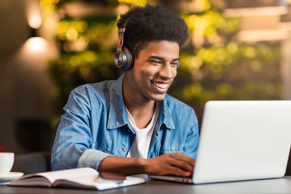 College student enjoying streaming video as part of a course he's taking