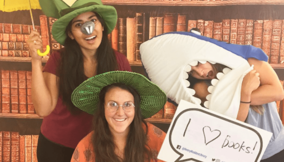 Librarians wearing costumes during library orientation