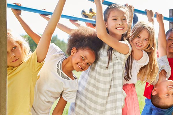 Happy elementary school students on the playground