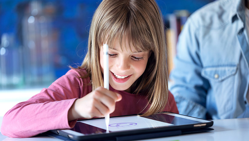 Student using a digital drawing tool to draw a smiley face