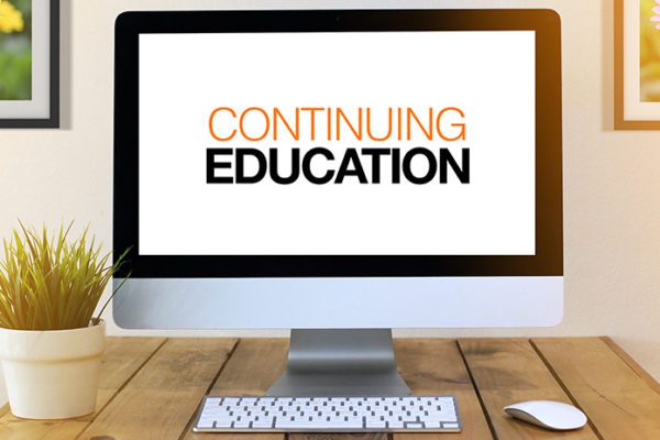 computer monitor with "Continuing Education" on the screen