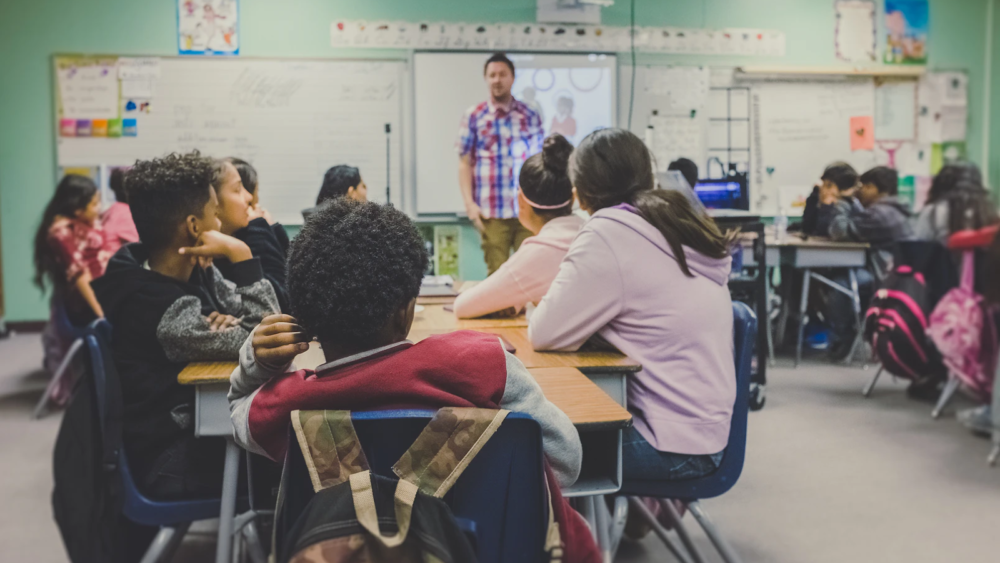 Teacher leading a middle school class